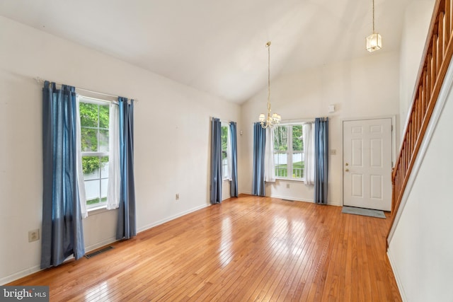 22 Regents Ct, Bensalem, PA 19020 - unfurnished room with a chandelier, light wood-style floors, high vaulted ceiling, and baseboards