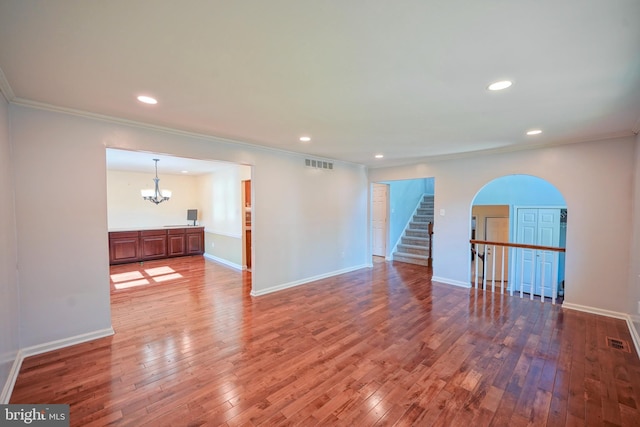 30 Lancelot Ln, Mount Laurel, NJ 08054 - unfurnished room with ornamental molding, arched walkways, stairway, hardwood / wood-style flooring, and a chandelier