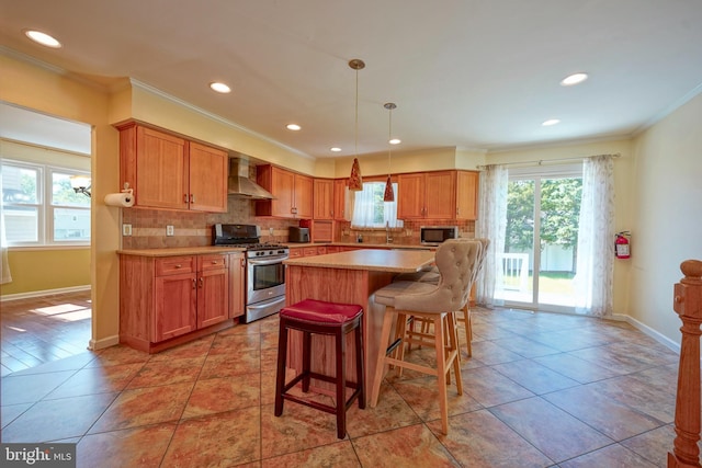 30 Lancelot Ln, Mount Laurel, NJ 08054 - kitchen featuring appliances with stainless steel finishes, wall chimney range hood, crown molding, backsplash, and light countertops
