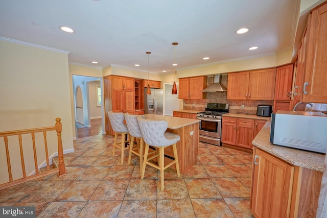 30 Lancelot Ln, Mount Laurel, NJ 08054 - kitchen featuring stainless steel appliances, wall chimney range hood, a kitchen island, a breakfast bar, and decorative backsplash