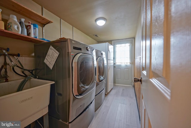 30 Lancelot Ln, Mount Laurel, NJ 08054 - laundry area with light wood-style flooring and independent washer and dryer