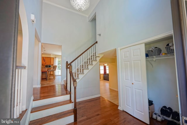 30 Lancelot Ln, Mount Laurel, NJ 08054 - stairs with wood finished floors, a chandelier, ornamental molding, a high ceiling, and baseboards