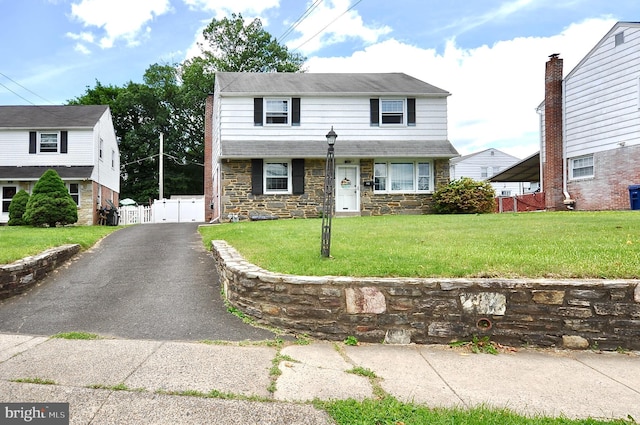812 Jenkintown Rd, Elkins Park, PA 19027 - view of front of property with stone siding, a gate, and asphalt driveway