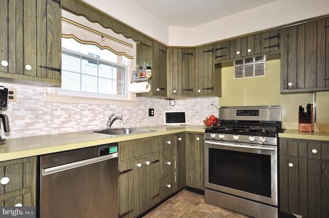 812 Jenkintown Rd, Elkins Park, PA 19027 - kitchen featuring appliances with stainless steel finishes, light countertops, a sink, and tasteful backsplash