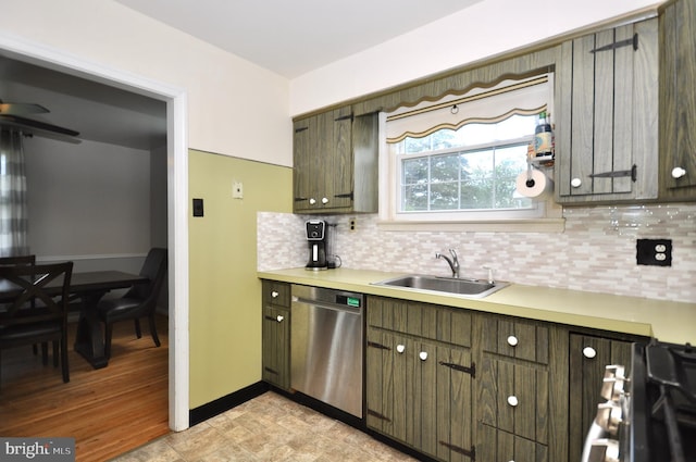 812 Jenkintown Rd, Elkins Park, PA 19027 - kitchen with stainless steel appliances, a sink, backsplash, light countertops, and baseboards
