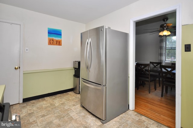 812 Jenkintown Rd, Elkins Park, PA 19027 - kitchen with freestanding refrigerator, stone finish flooring, a ceiling fan, and baseboards