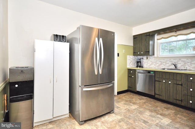 812 Jenkintown Rd, Elkins Park, PA 19027 - kitchen featuring stainless steel appliances, a sink, stone finish flooring, tasteful backsplash, and light countertops