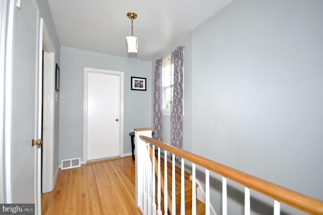 812 Jenkintown Rd, Elkins Park, PA 19027 - hall featuring an upstairs landing, light wood-style flooring, and baseboards