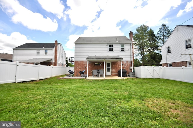 812 Jenkintown Rd, Elkins Park, PA 19027 - back of house with brick siding, a patio area, and a chimney