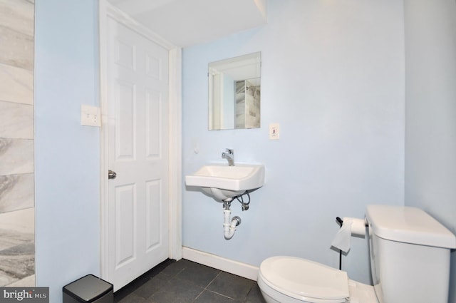 812 Jenkintown Rd, Elkins Park, PA 19027 - bathroom with toilet, tile patterned flooring, and a sink