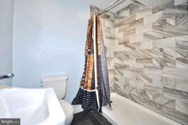 812 Jenkintown Rd, Elkins Park, PA 19027 - bathroom featuring toilet, a stall shower, a sink, and tile patterned floors