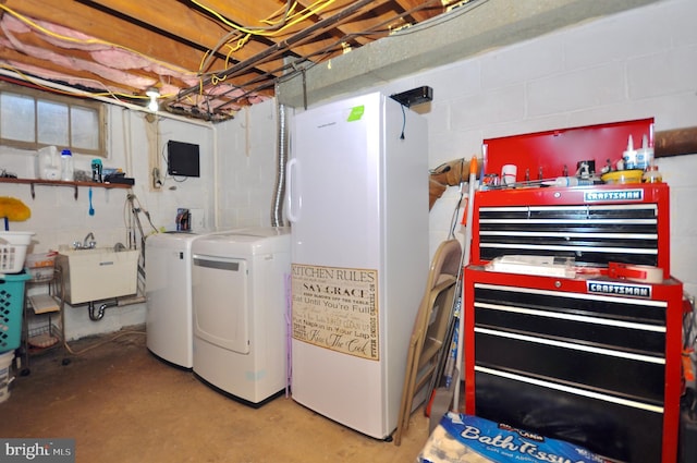 812 Jenkintown Rd, Elkins Park, PA 19027 - laundry room featuring water heater, concrete block wall, and washing machine and dryer