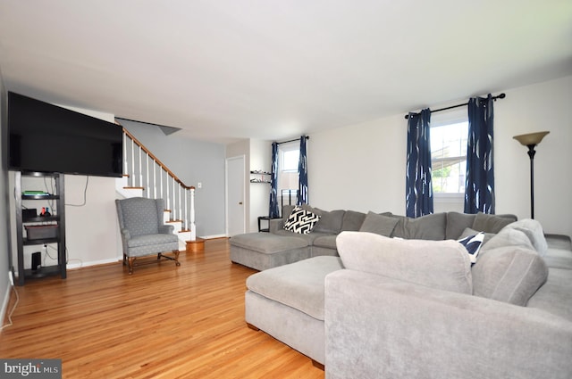 812 Jenkintown Rd, Elkins Park, PA 19027 - living area with light wood finished floors, stairway, and baseboards