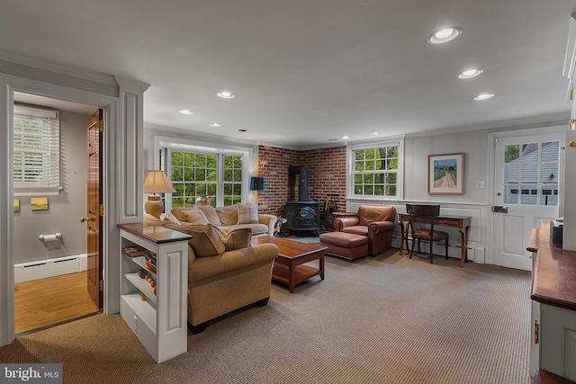 410 Heatherwood Ln, Devon, PA 19333 - living area with a wood stove, a baseboard heating unit, ornamental molding, recessed lighting, and a wainscoted wall