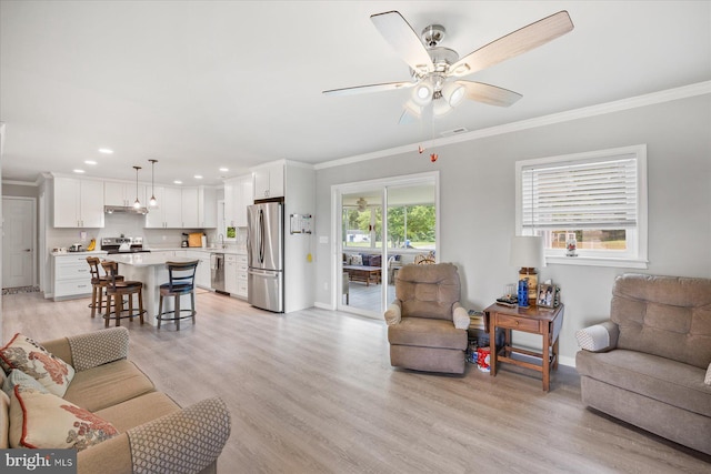 36032 Double Bridges Rd, Frankford, DE 19945 - living area with ornamental molding, ceiling fan, recessed lighting, and light wood finished floors