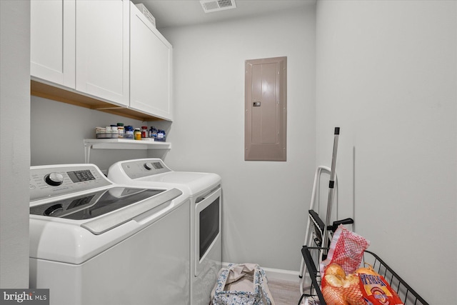 36032 Double Bridges Rd, Frankford, DE 19945 - laundry area featuring electric panel, independent washer and dryer, cabinet space, and light wood finished floors