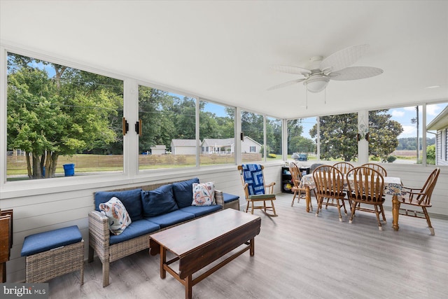 36032 Double Bridges Rd, Frankford, DE 19945 - sunroom with ceiling fan, outdoor lounge area, outdoor dining space, and view of wooded area