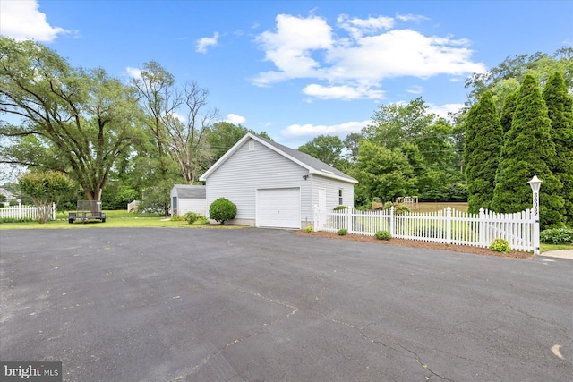 36032 Double Bridges Rd, Frankford, DE 19945 - view of property exterior with a garage, an outbuilding, and driveway