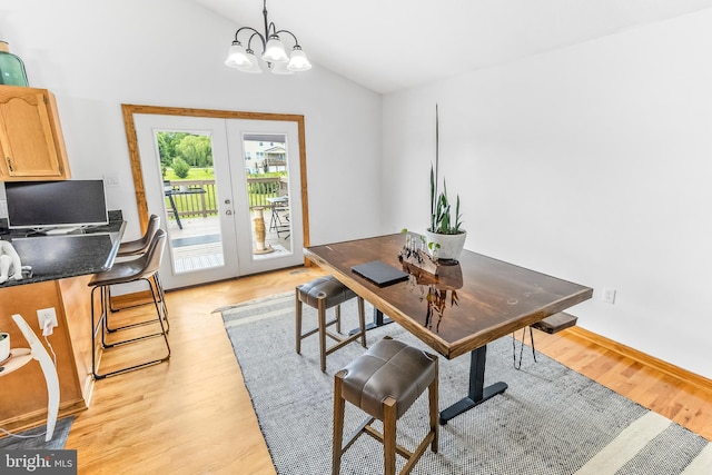 362 Sudley Ln, Martinsburg, WV 25403 - dining room featuring french doors, an office area, lofted ceiling, a chandelier, and light wood finished floors
