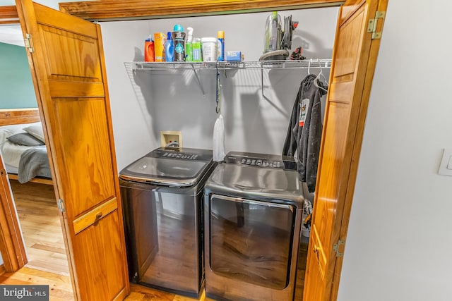 362 Sudley Ln, Martinsburg, WV 25403 - laundry area with washing machine and clothes dryer and light wood-style flooring
