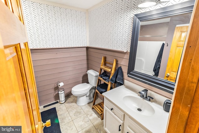 362 Sudley Ln, Martinsburg, WV 25403 - bathroom featuring vanity, toilet, tile patterned floors, and wooden walls