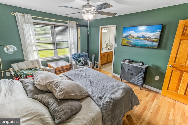 362 Sudley Ln, Martinsburg, WV 25403 - bedroom with light wood finished floors, baseboards, ensuite bathroom, and ceiling fan