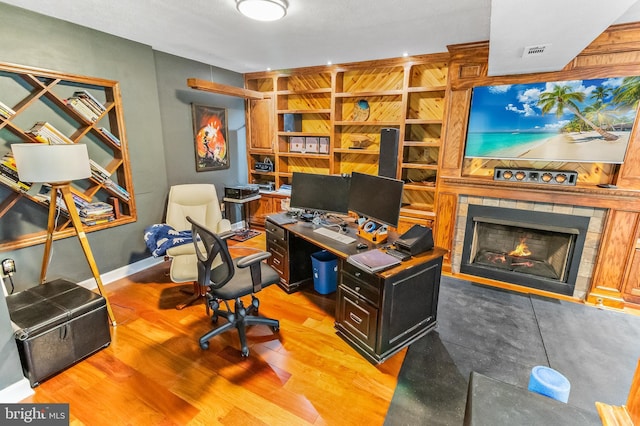 362 Sudley Ln, Martinsburg, WV 25403 - office space with a fireplace, wood finished floors, and baseboards