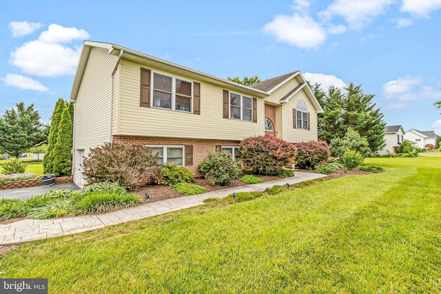 362 Sudley Ln, Martinsburg, WV 25403 - bi-level home with a front lawn, brick siding, and a garage