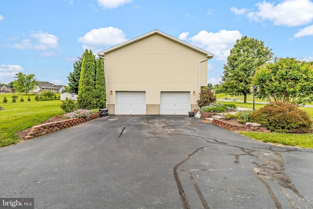 362 Sudley Ln, Martinsburg, WV 25403 - view of side of property with driveway, an attached garage, and a yard