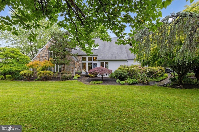 3 White Horse Ln, Spring City, PA 19475 - rear view of property with a lawn, a shingled roof, and stone siding