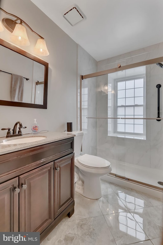 3331 Lakeside View Dr Unit 6-8, Falls Church, VA 22041 - bathroom featuring vanity, a stall shower, marble finish flooring, and toilet