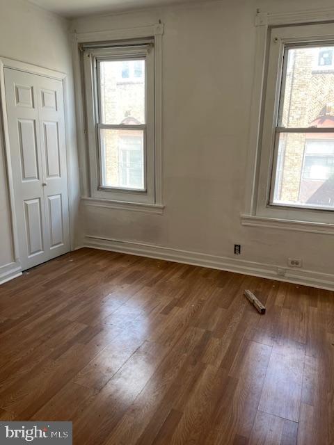2508 S Marshall St, Philadelphia, PA 19148 - empty room featuring dark wood-type flooring and baseboards