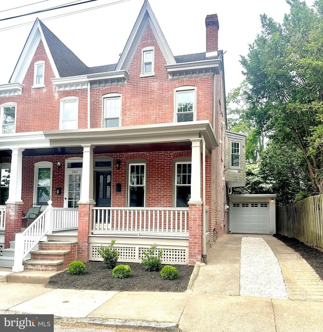 2304 W 19th St, Wilmington, DE 19806 - multi unit property featuring brick siding, concrete driveway, covered porch, and a garage