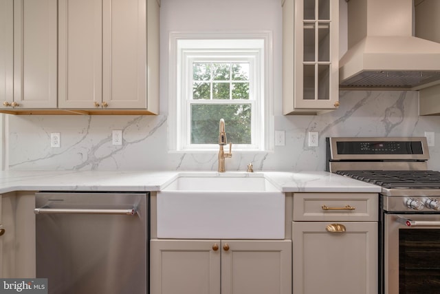 2304 W 19th St, Wilmington, DE 19806 - kitchen featuring stainless steel appliances, custom exhaust hood, a sink, decorative backsplash, and glass insert cabinets