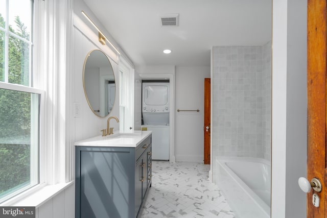 2304 W 19th St, Wilmington, DE 19806 - full bathroom with stacked washing machine and dryer, vanity, healthy amount of natural light, baseboards, and recessed lighting
