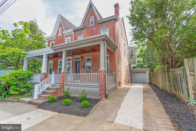 2304 W 19th St, Wilmington, DE 19806 - view of front of house with driveway, brick siding, covered porch, and a chimney
