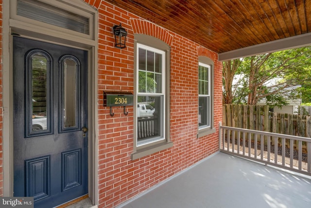 2304 W 19th St, Wilmington, DE 19806 - view of exterior entry with a porch and brick siding