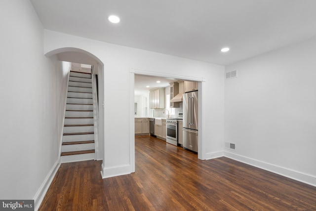 2304 W 19th St, Wilmington, DE 19806 - unfurnished living room with dark wood-type flooring, baseboards, a sink, recessed lighting, and stairs