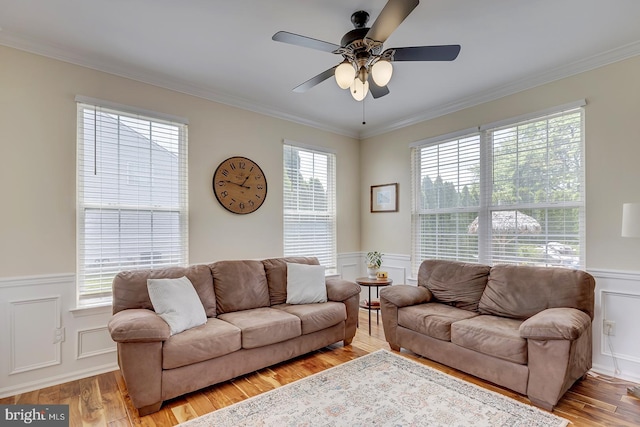 229 Lakshman Trl, Dover, DE 19904 - living room with wainscoting, ornamental molding, a ceiling fan, light wood-style flooring, and a decorative wall