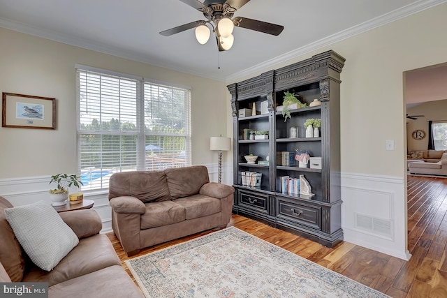 229 Lakshman Trl, Dover, DE 19904 - living area featuring a ceiling fan, ornamental molding, wainscoting, and wood finished floors