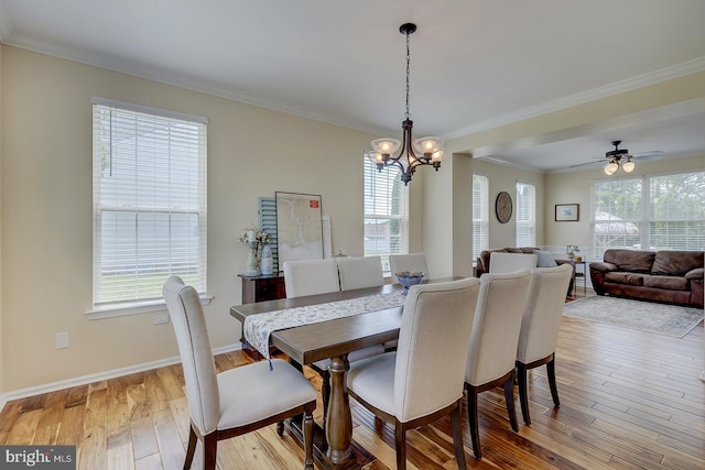 229 Lakshman Trl, Dover, DE 19904 - dining room with a chandelier, hardwood / wood-style flooring, ornamental molding, baseboards, and a ceiling fan