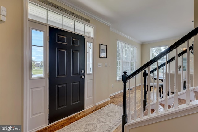 229 Lakshman Trl, Dover, DE 19904 - foyer with crown molding, stairway, wood finished floors, and baseboards