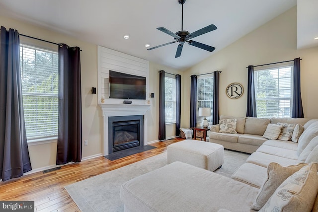 229 Lakshman Trl, Dover, DE 19904 - living room with a ceiling fan, wood finished floors, vaulted ceiling, a fireplace, and recessed lighting