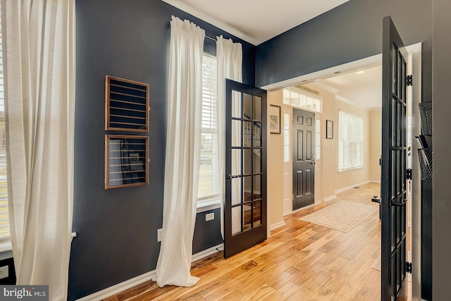 229 Lakshman Trl, Dover, DE 19904 - hall with wood finished floors, crown molding, and baseboards