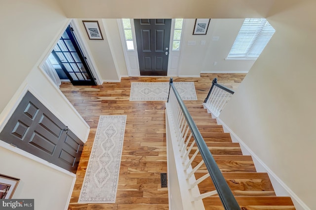 229 Lakshman Trl, Dover, DE 19904 - foyer featuring wood finished floors, baseboards, and stairway