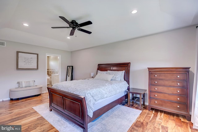 229 Lakshman Trl, Dover, DE 19904 - bedroom with light wood-style floors, lofted ceiling, baseboards, recessed lighting, and ensuite bathroom