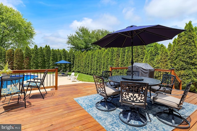 229 Lakshman Trl, Dover, DE 19904 - wooden terrace featuring outdoor dining area, grilling area, and an outdoor pool