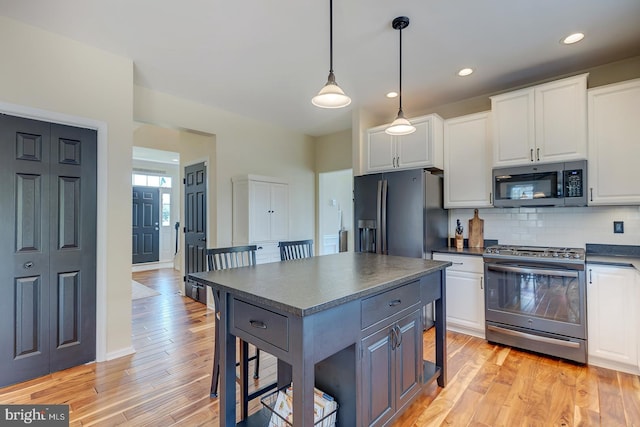 229 Lakshman Trl, Dover, DE 19904 - kitchen featuring appliances with stainless steel finishes, dark countertops, white cabinetry, and recessed lighting