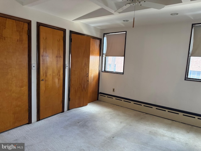 914 Fernon St, Philadelphia, PA 19148 - unfurnished bedroom with a baseboard radiator, carpet floors, two closets, and a ceiling fan