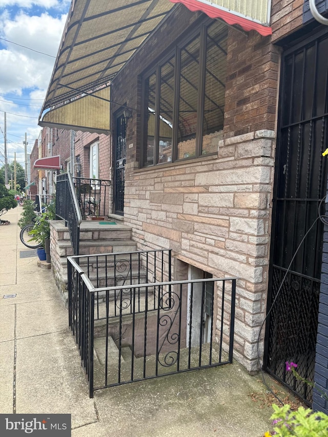 914 Fernon St, Philadelphia, PA 19148 - property entrance featuring brick siding and stone siding